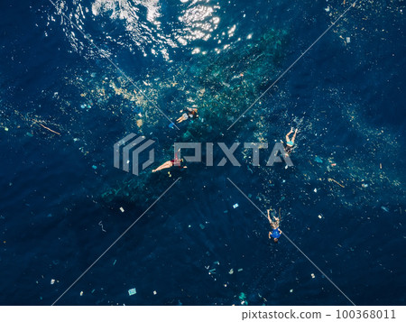 People snorkeling in plastic pollution at Liberty wreck ship in Tulamben, Bali. People snorkeling in plastic pollution at Liberty wreck ship in Tulamben, Bali. 100368011