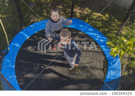 children jump on the trampoline 100369328
