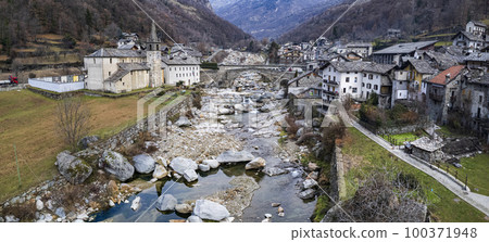most beautiful Alpine villages of northern Italy- Lillianes, medieval borgo in Valle d'Aosta region, aerial drone view. most beautiful Alpine villages of northern Italy- Lillianes, medieval borgo in Valle d'Aosta region, aerial drone view. 100371948