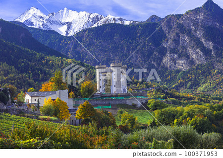 Valle d'Aosta, Italy. Beautiful northern region famous with medieval castles. view of Aymavilles surrounded by Alps mountains Valle d'Aosta, Italy. Beautiful northern region famous with medieval castles. view of Aymavilles surrounded by Alps mountains 100371953