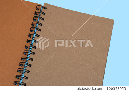 Notebook, with place for your image, text or corporate identity details. Spiral notepad on a table. Notebook, with place for your image, text or corporate identity details. Spiral notepad on a table. 100372053