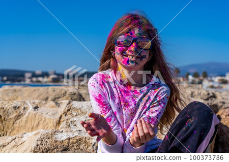 Young european girl celebrating holy festival on a blue sky background 100373786