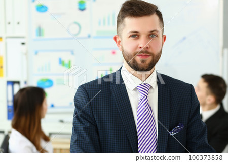 Portrait of a young smiling businessman successful entrepreneur winning meeting 100373858