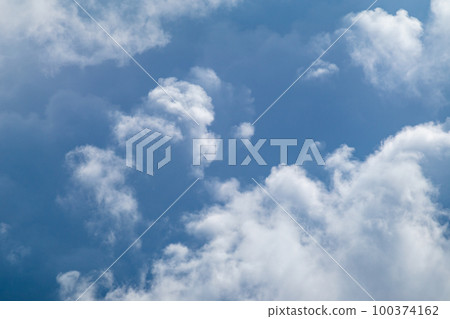 High layered white epic clouds on blue sky 100374162