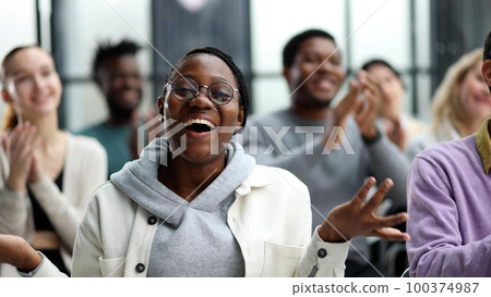 Businessmen attentively listen to the instructor at the lecture Businessmen attentively listen to the instructor at the lecture 100374987