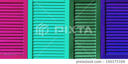 Part of modern interior with colorful patterned texture of wooden colored shutters, casements or blinds background Part of modern interior with colorful patterned texture of wooden colored shutters, casements or blinds background 100375389