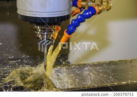 The CNC milling machine cutting the tire mold parts with oil coolant method . The CNC milling machine cutting the tire mold parts with oil coolant method . 100379731