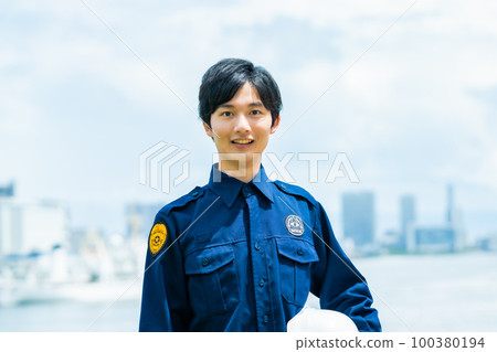A young guard man doing port security A young guard man doing port security 100380194