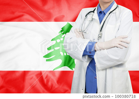 Doctor standing with the flag Doctor standing with the flag 100380718