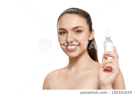 Smiling young beautiful girl with well-kept skin isolated over white studio background. Facial cosmetics masks. Concept of natural beauty, skincare, cosmetology, health, ad Smiling young beautiful girl with well-kept skin isolated over white studio background. Facial cosmetics masks. Concept of natural beauty, skincare, cosmetology, health, ad 100381039