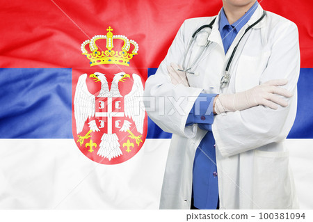 Doctor standing with the flag Doctor standing with the flag 100381094
