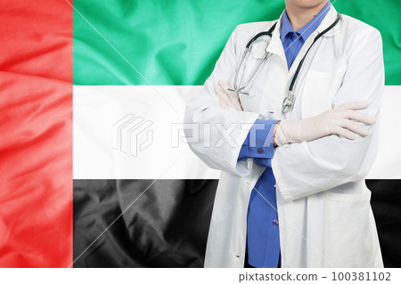 Doctor standing with the flag 100381102