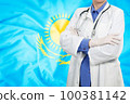 Doctor standing with the flag 100381142
