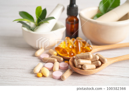 Alternative medicine herbal organic capsule with vitamin E omega 3 fish oil, mineral, drug with herbs leaf natural supplements for healthy good life. 100382366