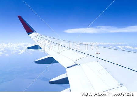 sky and wing of the plane sky and wing of the plane 100384231