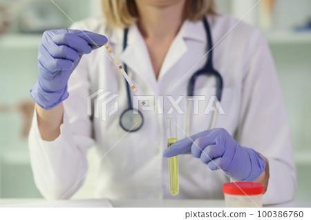Female doctor conducts scientific research in laboratory. 100386760