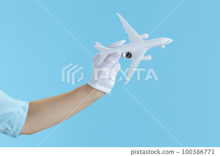 Closeup on female air hostess on blue Closeup on female air hostess on blue 100386771