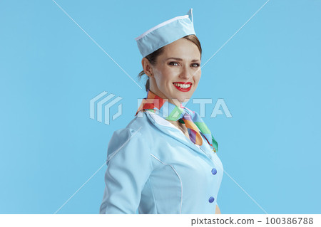 smiling modern flight attendant woman on blue smiling modern flight attendant woman on blue 100386788