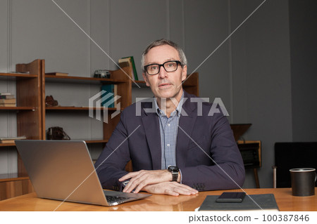 Mature grey haired businessman or entrepreneur Mature grey haired businessman or entrepreneur 100387846