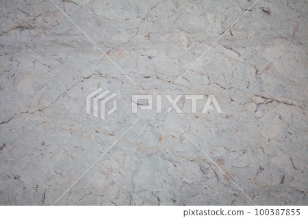 Light gray stone background, surface with cracks 100387855
