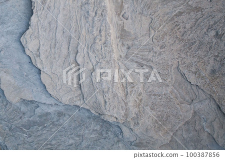 Gray rocky surface, background, stone pattern with cracks 100387856