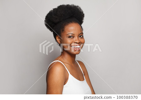 Happy woman laughing on white background Happy woman laughing on white background 100388370