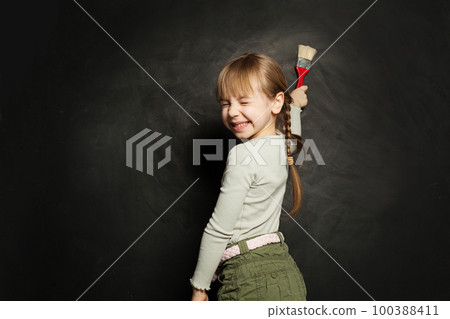 Happy child girl painting on school blackboard. Back to school, education, student, pupil Happy child girl painting on school blackboard. Back to school, education, student, pupil 100388411