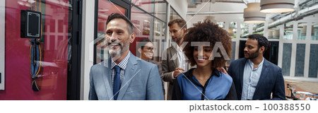 Group of multiethnic business people crossing office together Group of multiethnic business people crossing office together 100388550