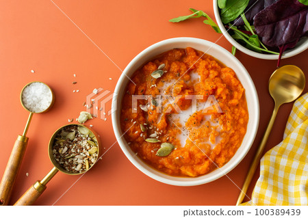 Pumpkin soup with seeds and coconut milk Pumpkin soup with seeds and coconut milk 100389439