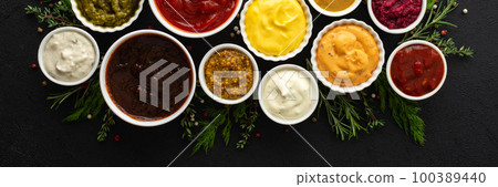 Sauces in bowls with seasonings 100389440