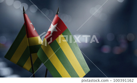 Small flags of the Togo on an abstract blurry background Small flags of the Togo on an abstract blurry background 100391162