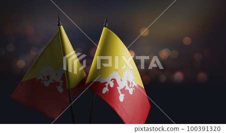 Small flags of the Bhutan on an abstract blurry background Small flags of the Bhutan on an abstract blurry background 100391320
