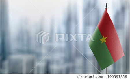 Small flags of the Burkina Faso on an abstract blurry background 100391838