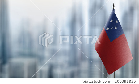 Small flags of the Samoa on an abstract blurry background 100391839