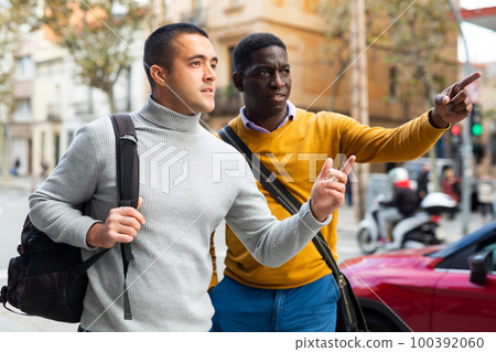 Two men tourists visiting the sights of european city Two men tourists visiting the sights of european city 100392060