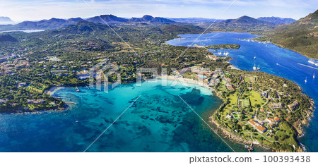 Italy summer holidyas . Sardegna island - stunning Emerald coast (costa smeralda) with  beautiful beaches. aerial view of Ira beach with turquoise sea Italy summer holidyas . Sardegna island - stunning Emerald coast (costa smeralda) with  beautiful beaches. aerial view of Ira beach with turquoise sea 100393438