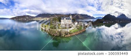 Amazing scenic lakes of European Alps - beautiful Annecy with fairytale castle Duingt. aerial panoramic view. France travel Amazing scenic lakes of European Alps - beautiful Annecy with fairytale castle Duingt. aerial panoramic view. France travel 100393449
