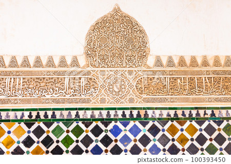 amazing Alhambra palace - mosaic and carved walls in arabian style in Granada, Andalusia, Spain 100393450