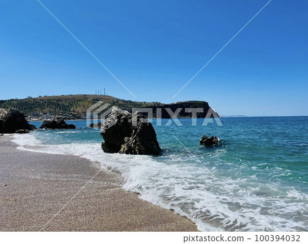 Rocky beach and crystal turquoise water of Ionian Sea in Albania. Rocky beach and crystal turquoise water of Ionian Sea in Albania. 100394032