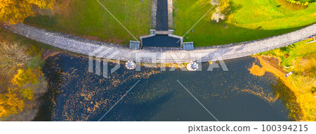 Fojtka water reservoir surrounded by vibrant colored forest at autumn time. Aerial view from drone. 100394215