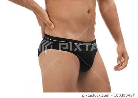 Man in black underwear on white background, closeup Man in black underwear on white background, closeup 100396454
