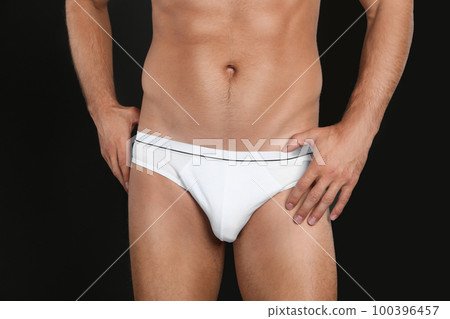 Man in underwear on black background, closeup Man in underwear on black background, closeup 100396457