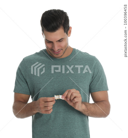 Happy man with sticking plaster on white background Happy man with sticking plaster on white background 100396458