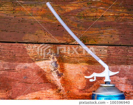 Construction foam cylinder on a wooden background. Construction foam cylinder on a wooden background. 100396940