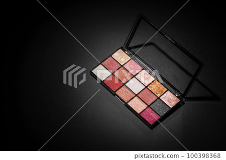 Color professional cosmetic palette on a dark background Color professional cosmetic palette on a dark background 100398368
