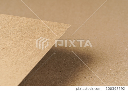 Brown recycled carton paper sheets close up Brown recycled carton paper sheets close up 100398392