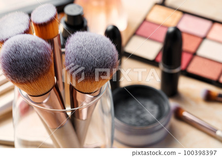 Decorative cosmetics and tools on dressing table in makeup room Decorative cosmetics and tools on dressing table in makeup room 100398397