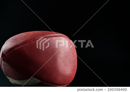 American foottball ball on dark background close up 100398400