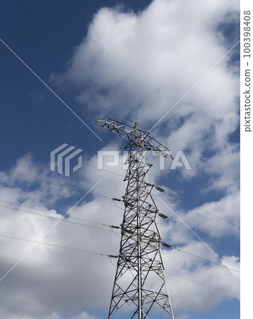 Transmission tower and blue sky looking up from below Transmission tower and blue sky looking up from below 100398408