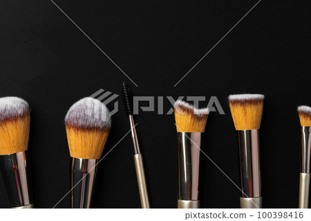 Collection of make up brushes on black background Collection of make up brushes on black background 100398416